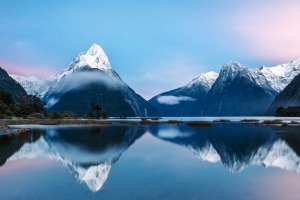 Awesome sunrise over Mitre peak and mountains of Milford Sound, Fiordland National Park, Southland, New Zealand ...